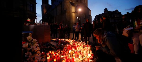 Mourners gather at the market square in Halle, Germany on 10 October 2019, after two people were killed in a shooting Mourners gather at the market square in Halle, Germany on 10 October 2019, after two people were killed in a shooting - Sputnik International