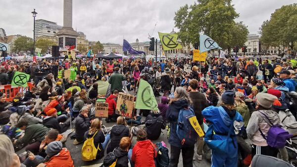 Extinction Rebellion activists block a major thruway to obstruct traffic during a major rally near Trafalgar Square in London, UK on Friday, 11 October 2019 - Sputnik International