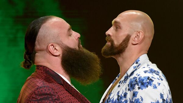 WWE wrestler Braun Strowman (L) and heavyweight boxer Tyson Fury face off during the announcement of their match at a WWE news conference at T-Mobile Arena on October 11, 2019 in Las Vegas, Nevada.  - Sputnik International