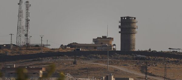 In this photo taken from the Turkish side of the border between Turkey and Syria, in Suruc, southeastern Turkey, a U.S forces outpost is seen on a hilltop outside Ayn Al Arab or Kobani, Syria, Saturday, Oct. 12, 2019. In this photo taken from the Turkish side of the border between Turkey and Syria, in Suruc, southeastern Turkey, a U.S forces outpost is seen on a hilltop outside Ayn Al Arab or Kobani, Syria, Saturday, Oct. 12, 2019. - Sputnik International