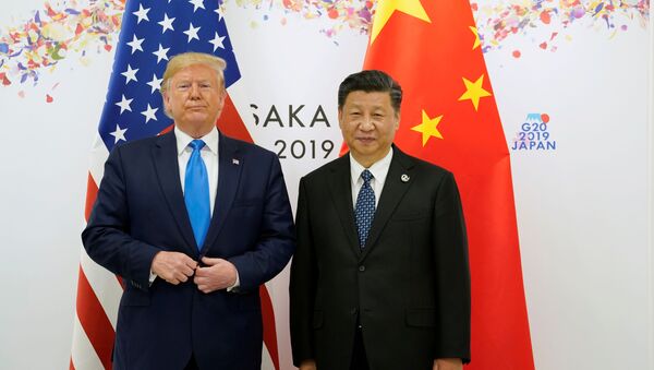  U.S. President Donald Trump poses for a photo with China's President Xi Jinping before their bilateral meeting during the G20 leaders summit in Osaka, Japan, June 29, 2019 - Sputnik International