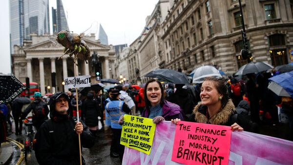 Protesters chant slogans at they block the road during an Extinction Rebellion demonstration at Bank, in the City of London, Britain October 14, 2019 - Sputnik International