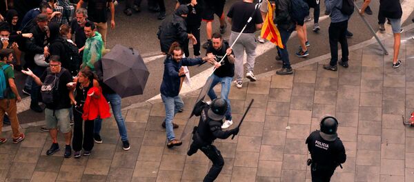 Protesters clash with police during a demonstration at Barcelona's airport, after a verdict in a trial over a banned independence referendum, Spain October 14, 2019 - Sputnik International
