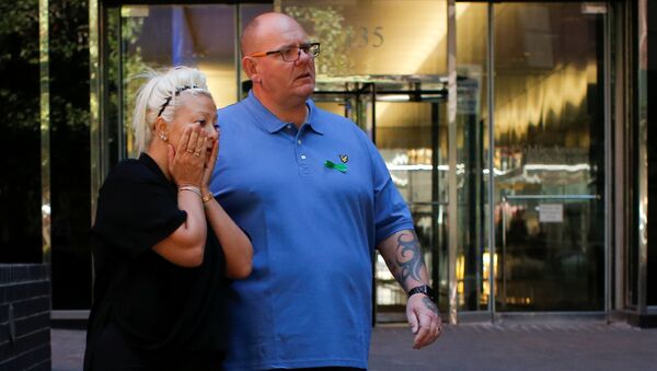 Charlotte Charles and Tim Dunn, parents of British teen Harry Dunn who was killed in a car crash on his motorcycle, allegedly by the wife of an American diplomat, walk out after an interview in the Manhattan borough of New York City, New York, U.S., October 15, 2019 - Sputnik International