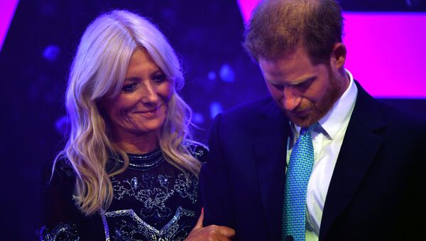 Britain's Prince Harry reacts next to television presenter Gaby Roslin as he delivers a speech during the WellChild Awards Ceremony reception in London, Britain, October 15, 2019 - Sputnik International