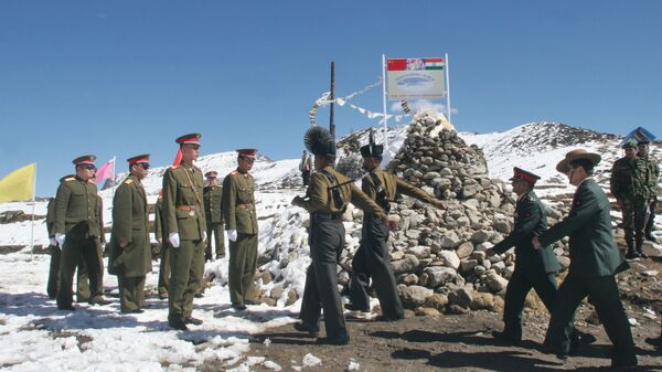 A delegation of the Indian Army, right, marches to meet the delegation of the Chinese army, left, at a Border Personnel Meeting (BPM) on the Chinese side of the Line of Actual Control at Bumla, Indo-China Border, Monday, Oct. 30, 2006 - Sputnik International