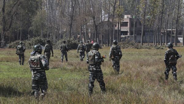 Indian paramilitary soldiers patrol near the site of a gunbattle in Bijbehara, south of Srinagar, Indian controlled Kashmir, Wednesday, Oct. 16, 2019 - Sputnik International