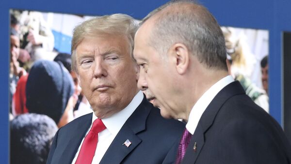U.S. President Donald Trump, left, talks to Turkish President Recep Tayyip Erdogan as they tour the new NATO headquarters in Brussels, Belgium, Wednesday, July 11, 2018 - Sputnik International