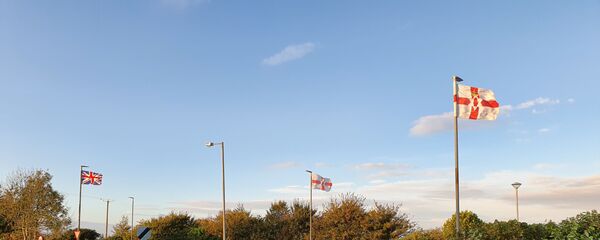 Northern Irish and British flags flying near Strabane - Sputnik International