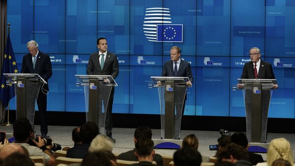 EU chief Brexit negotiator Michel Barnier, Ireland's Prime Minister Leo Varadkar, European Council President Donald Tusk and European Commission President Jean-Claude Juncker address a press conference during an European Union Summit at European Union Headquarters in Brussels on October 17, 2019. - Sputnik International