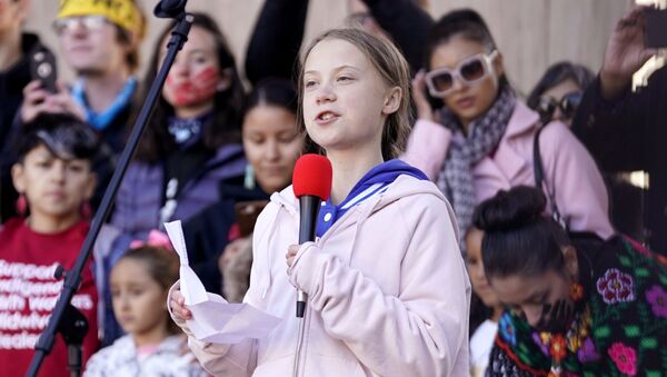 Swedish teen environmental activist Greta Thunberg speaks as people take part in a climate change rally in Denver, Colorado, 11 October 2019 - Sputnik International