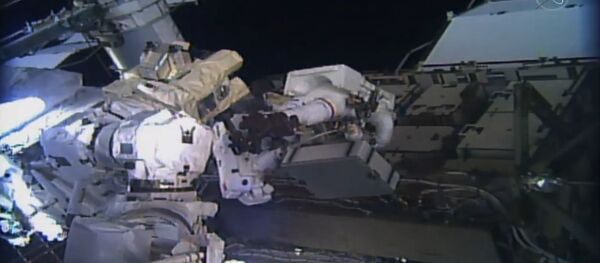 This image taken from NASA TV shows, astronaut Christina Koch (C L) and Jessica Meir (C R) during their spacewalk at the International Space Station on October 18, 2019. This image taken from NASA TV shows, astronaut Christina Koch (C L) and Jessica Meir (C R) during their spacewalk at the International Space Station on October 18, 2019. - Sputnik International