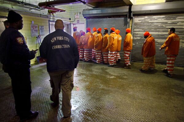 This photo shows a group of inmates leaving the jail bakery after completing a morning shift in March 2011. - Sputnik International