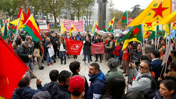 Pro-Kurdish demonstrators protest against Turkey's military action in northeastern Syria in Cologne, Germany, October 19, 2019. - Sputnik International