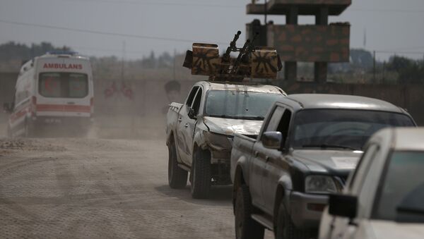 Turkey-backed Syrian rebel fighters return from the Syrian border town of Tal Abyad, as they are pictured on the Turkish-Syrian border in Akcakale, Turkey, October 19, 2019. - Sputnik International