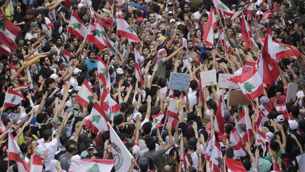 Anti-government protesters shout slogans in Beirut, Lebanon, Sunday, Oct. 20, 2019. Thousands of people are gathering in downtown Beirut as Lebanon is expected to witness the largest protests on the fourth day of anti-government demonstrations. - Sputnik International