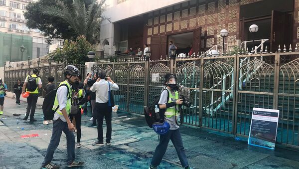 Members of the press are seen outside the Kowloon Masjid and Islamic Centre in Hong Kong, China, after police doused it with a water cannon, on October 20, 2019 in this picture obtained from social media - Sputnik International