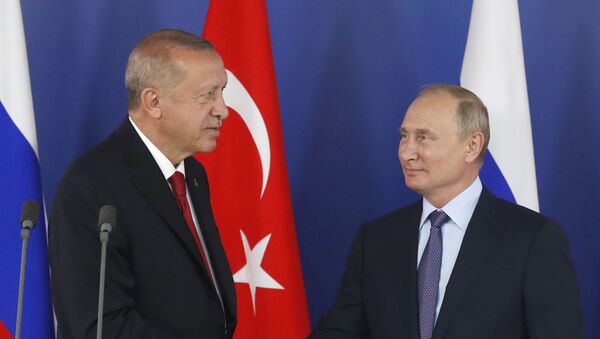 Turkish President Recep Tayyip Erdogan, left, shakes hands with Russian President Vladimir Putin during a joint news conference following their talks on the sidelines of the MAKS-2019 International Aviation and Space Show in Zhukovsky, outside Moscow, Russia, Tuesday, Aug. 27, 2019. Turkish President is on a short working visit in Russia.  - Sputnik International