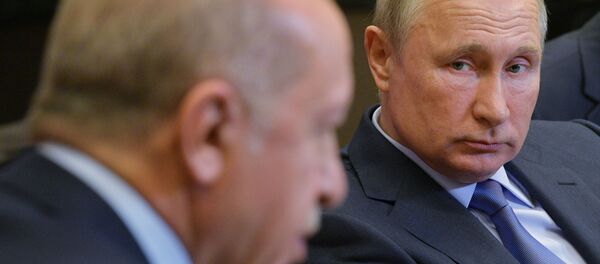Russian President Vladimir Putin listens to his Turkish counterpart Recep Tayyip Erdogan during their meeting in the Black Sea resort of Sochi, Russia - Sputnik International