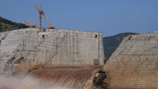 Water flows through Ethiopia's Grand Renaissance Dam as it undergoes construction work on the river Nile in Guba Woreda, Benishangul Gumuz Region, Ethiopia September 26, 2019 - Sputnik International