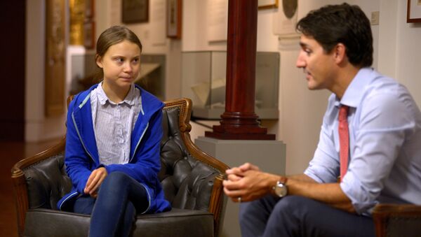 Canada's Prime Minister Justin Trudeau greets Swedish climate change teen activist Greta Thunberg before a climate strike march in Montreal, Quebec, Canada September 27, 2019 - Sputnik International
