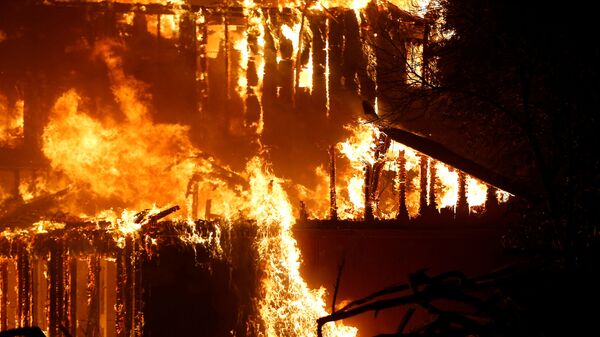 A structure burns during the Kincade fire in Geyserville, California - Sputnik International