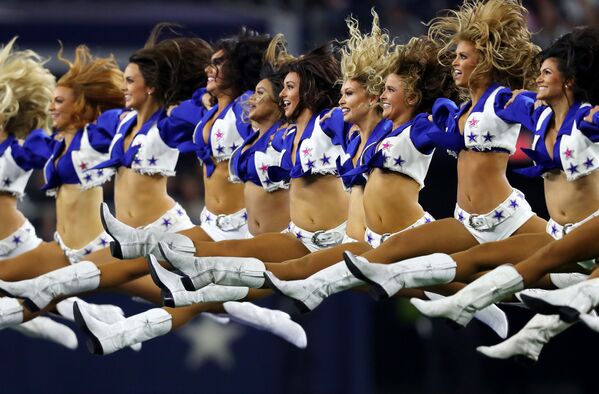Dallas Cowboys cheerleaders perform before the game between the Dallas Cowboys and the Philadelphia Eagles at AT&T Stadium on October 20, 2019 in Arlington, Texas.   - Sputnik International