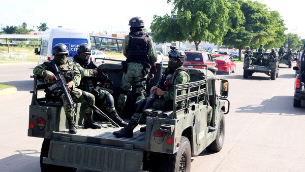 Members of a special unit of the Mexican Army conduct a patrol as part of an operation to increase security after cartel gunmen clashed with federal forces, resulting in the release of Ovidio Guzman from detention, the son of drug kingpin Joaquin El Chapo Guzman, in Culiacan, in Sinaloa state, Mexico October 19, 2019 - Sputnik International