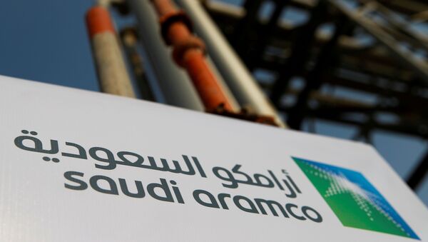 The Saudi Aramco logo is pictured at the company's oil facility in Abqaiq, Saudi Arabia, October 12, 2019 - Sputnik International