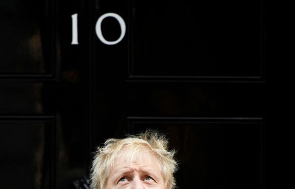 Britain's Prime Minister Boris Johnson reacts as he poses for a photo during a meeting with fundraisers for the Royal British Legion outside Downing Street in London, Britain October 28, 2019.  - Sputnik International