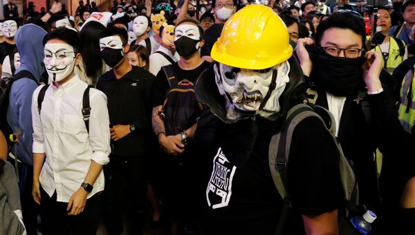 Anti-government protesters wear Guy Fawkes masks during a Halloween march in Lan Kwai Fong, Central district, Hong Kong, China October 31, 2019 - Sputnik International