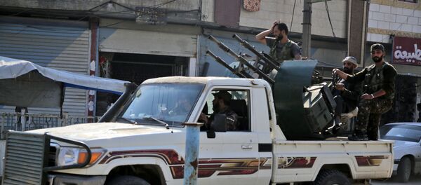 Turkish-backed Syrian fighters patrol the northern Syrian Kurdish town of Tal Abyad on the border between Syria and Turkey on October 31, 2019. Turkish-backed Syrian fighters patrol the northern Syrian Kurdish town of Tal Abyad on the border between Syria and Turkey on October 31, 2019. - Sputnik International
