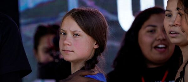 Swedish teen climate activist Greta Thunberg looks on during a march and rally at the Youth Climate Strike in Los Angeles, California, U.S., November 1, 2019. Swedish teen climate activist Greta Thunberg looks on during a march and rally at the Youth Climate Strike in Los Angeles, California, U.S., November 1, 2019. - Sputnik International