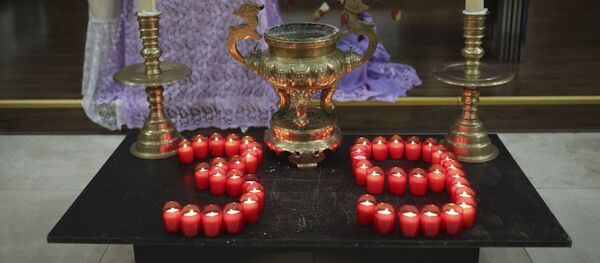 Candles are arranged in a 39 during a Mass and vigil for the 39 victims found dead inside the back of a truck in Grays, Essex, at The Holy Name and Our Lady of the Sacred Heart Church, east London's Vietnamese church on Saturday, Nov. 2, 2019. Candles are arranged in a 39 during a Mass and vigil for the 39 victims found dead inside the back of a truck in Grays, Essex, at The Holy Name and Our Lady of the Sacred Heart Church, east London's Vietnamese church on Saturday, Nov. 2, 2019. - Sputnik International