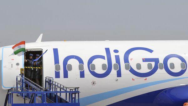 (FILES) In this file photograph taken on March 16, 2016, crew members of an IndiGo Airbus A320 aircraft wave an Indian national flag at The India Aviation 2016 airshow at Begumpet Airport in Hyderabad. Airbus announced on October 29, 2019, that India's IndiGo have ordered 300 A320neo aircraft. - Sputnik International