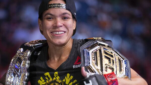 Amanda Nunes smiles after victory over Holly Holm during their women's bantamweight mixed martial arts title bout at UFC 239 on Saturday, July 6, 2019, in Las Vegas - Sputnik International