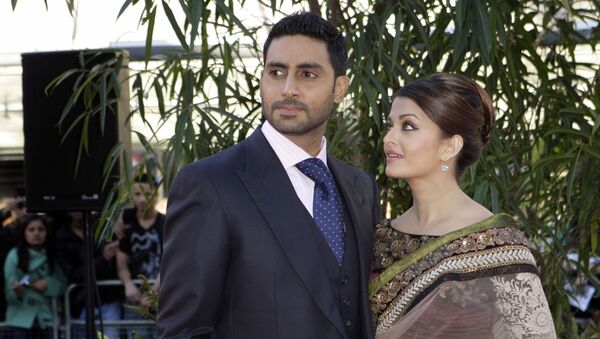 Indian actors Aishwarya Rai Bachchan, right, and husband Abhishek Bachchan arrive on the red carpet for the World Premiere of the film Raaven, at the BFI, British Film Institute, in London, Wednesday, June 16, 2010 - Sputnik International