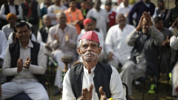 In this Feb. 2, 2017, file photo, a supporter applauds as he listens to Samajwadi Party candidate Sunil Choudhary during a election campaign - Sputnik International