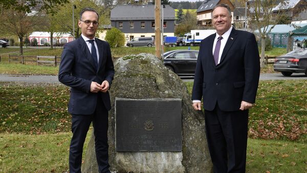 German Foreign Minister Heiko Maas and U.S. Secretary of State Mike Pompeo pose next to a memorial stone In honor of the 2d Armored Cavalry Regiment soldiers who patrolled along the Iron Curtain to protect freedom and peace in Western Europe during their visit to the village of Moedlareuth near Hof, Germany November 7, 2019 - Sputnik International