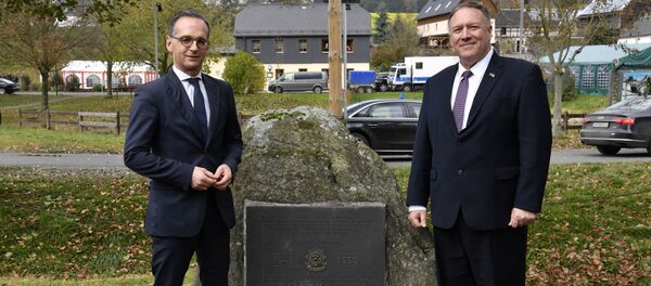 German Foreign Minister Heiko Maas and U.S. Secretary of State Mike Pompeo pose next to a memorial stone In honor of the 2d Armored Cavalry Regiment soldiers who patrolled along the Iron Curtain to protect freedom and peace in Western Europe during their visit to the village of Moedlareuth near Hof, Germany November 7, 2019 - Sputnik International