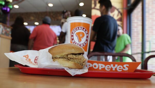 A chicken sandwich sits on a table at a Popeyes as guests wait in line, Thursday, Aug. 22, 2019, in Kyle, Texas - Sputnik International