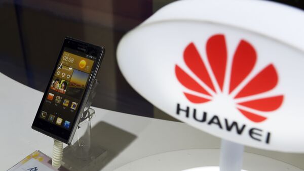 A mobile phone made by Chinese telecom equipment maker Huawei is displayed in a store in Beijing on August 3, 2015. Two Chinese smartphone makers pushed US technology giant Apple into third place in the world's biggest market in the second quarter, an independent analyst firm said on August 3.  - Sputnik International