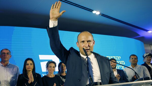 Naftali Bennett (C), member and candidate for the New Right party that is part of the Yamina political alliance, speaks while flanked by party leader Ayelet Shaked (2nd-L), Yamina candidate Ofir Sofer (2nd-R), and and Tkuma party leader and candidate Bezalel Smotrich (3rd-R), at the alliance's headquarters in Ramat Gan, north of Tel Aviv, late on September 17, 2019, as the first exit polls are announced on television. - Israeli Prime Minister Benjamin Netanyahu and his main challenger Benny Gantz were neck-and-neck in the country's general election after polls closed, exit surveys showed. Three separate exit polls carried by Israeli television stations showed Netanyahu's right-wing Likud and Gantz's centrist Blue and White alliance with between 31 and 34 parliament seats each out of 120.  - Sputnik International