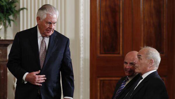 Secretary of State Rex Tillerson arrives to sit in the front row with national security adviser H.R. McMaster, center and White House Chief of Staff John Kelly - Sputnik International