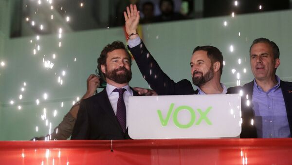 Santiago Abascal, leader of far-right Vox Party, waves to supporters as fireworks go off outside the party headquarters after the announcement of the general election first results, in Madrid, Sunday, Nov. 10, 2019. - Sputnik International
