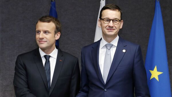 French President Emmanuel Macron, left, shakes hands with Polish Prime Minister Mateusz Morawiecki prior to a meeting on the sidelines of an EU summit in Brussels on Friday, Dec. 15, 2017.  - Sputnik International