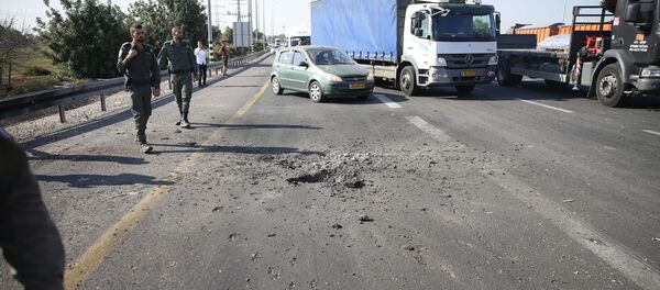 Israeli police block the road moments after a rocket fired by Palestinians militants from Gaza hit a main free way between Ashdod and Tel Aviv near Ashdod Israel, Tuesday, Nov. 12, 2019 Israeli police block the road moments after a rocket fired by Palestinians militants from Gaza hit a main free way between Ashdod and Tel Aviv near Ashdod Israel, Tuesday, Nov. 12, 2019 - Sputnik International