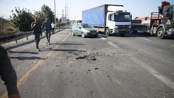 Israeli police block the road moments after a rocket fired by Palestinians militants from Gaza hit a main free way between Ashdod and Tel Aviv near Ashdod Israel, Tuesday, Nov. 12, 2019 - Sputnik International