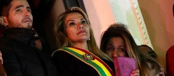 Bolivian Senator Jeanine Anez gestures after she declared herself as Interim President of Bolivia, at the balcony of the Presidential Palace, in La Paz, Bolivia November 12, 2019 - Sputnik International