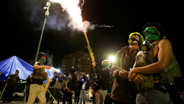Members of Youth Resistance Cochala set off fireworks to celebrate after Bolivian Senator Jeanine Anez became interim president, following Bolivia's former President Evo Morales' departure from the country, in Cochabanba, Bolivia November 12, 2019 - Sputnik International